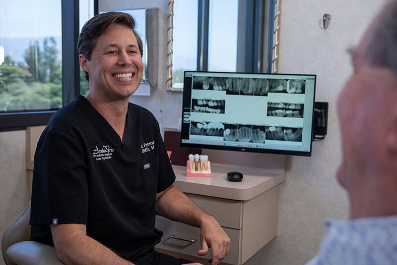 Dentist consulting with Paitent