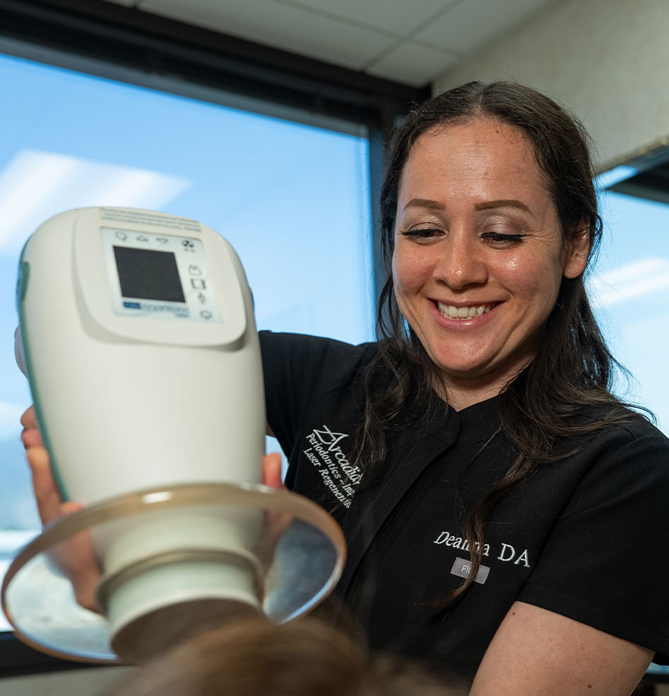 Team member taking a 3d scan of Patients teeth