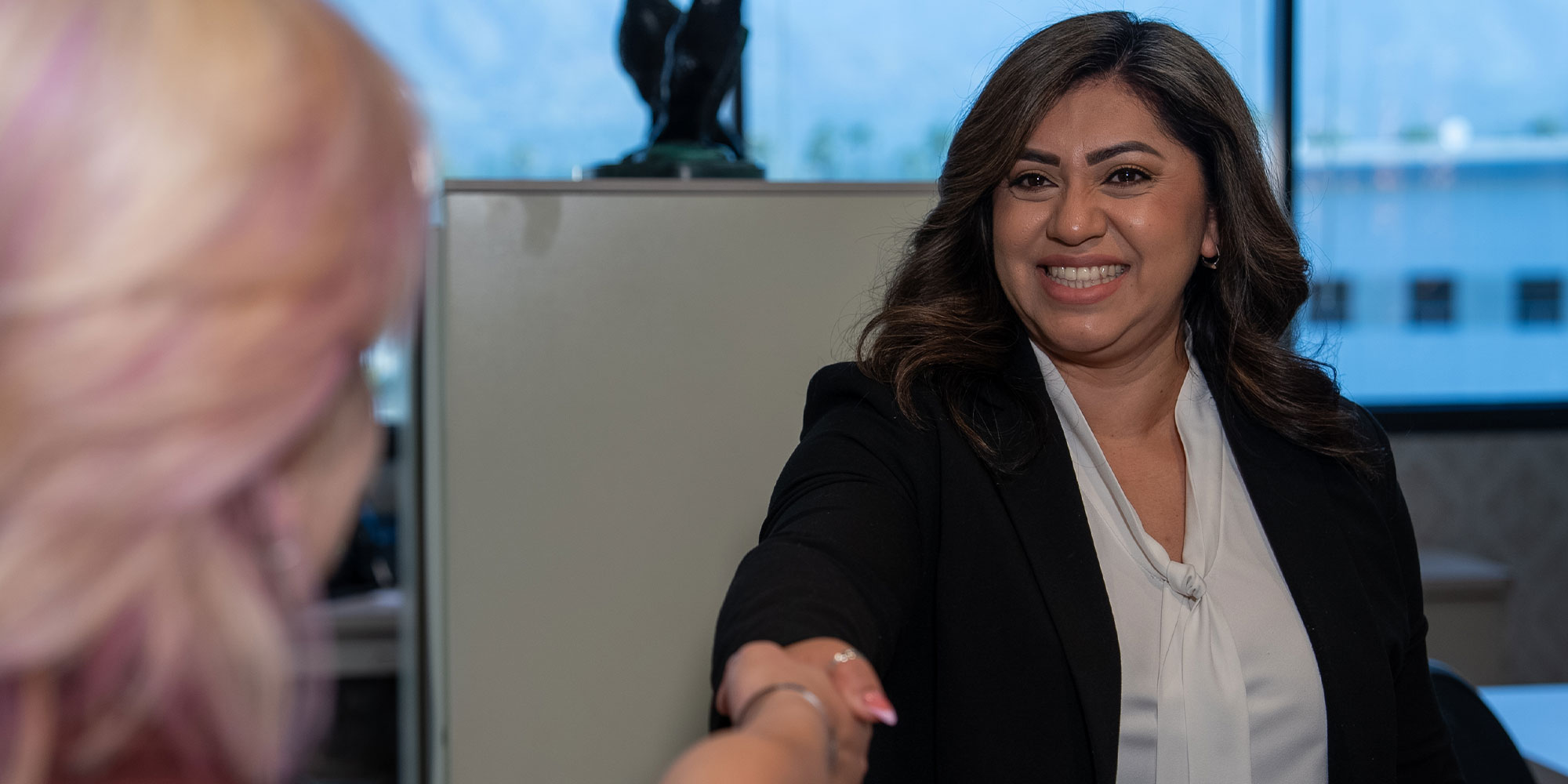 team member shaking Patients hand