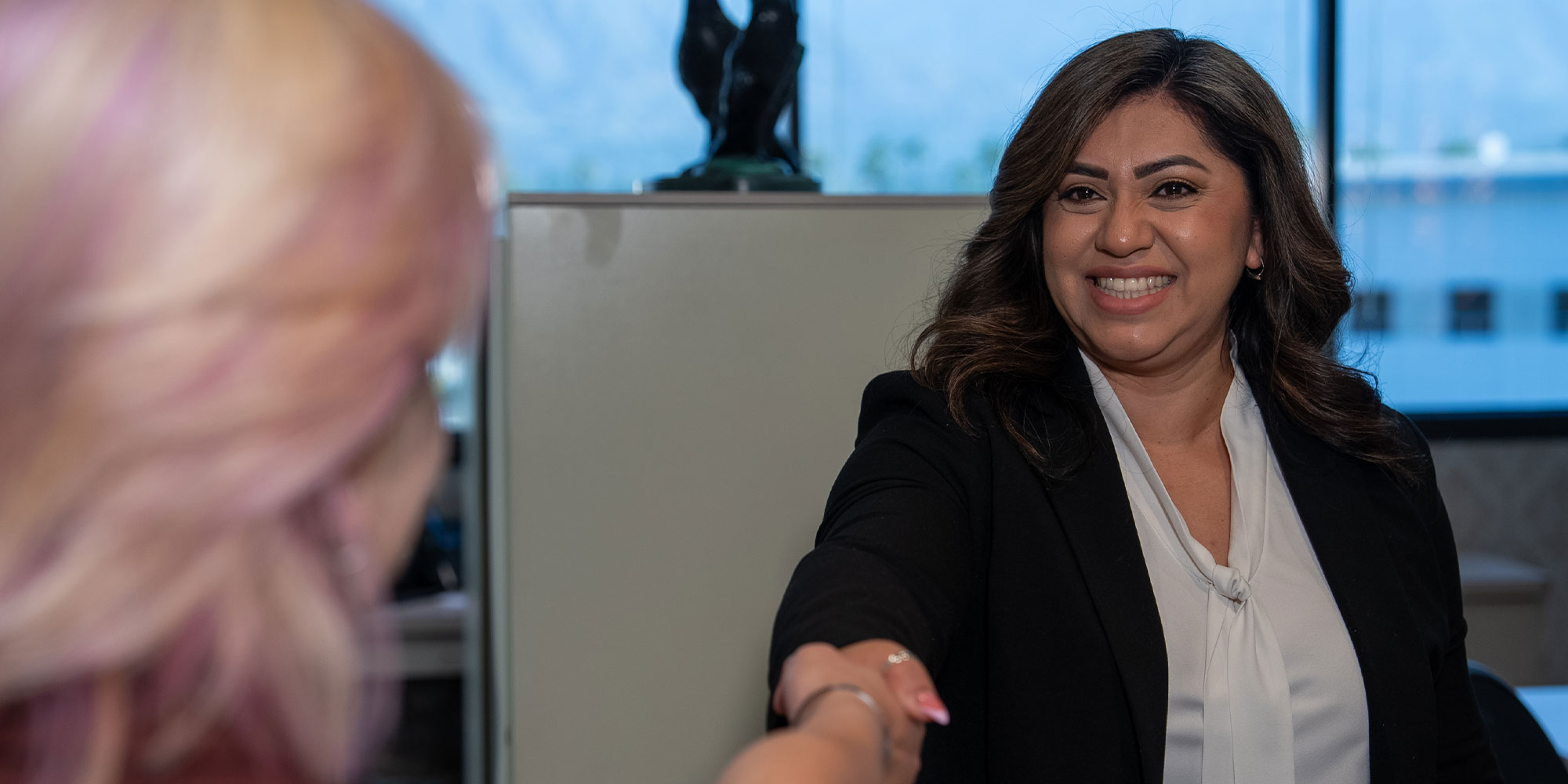 team member shaking Patient's hand