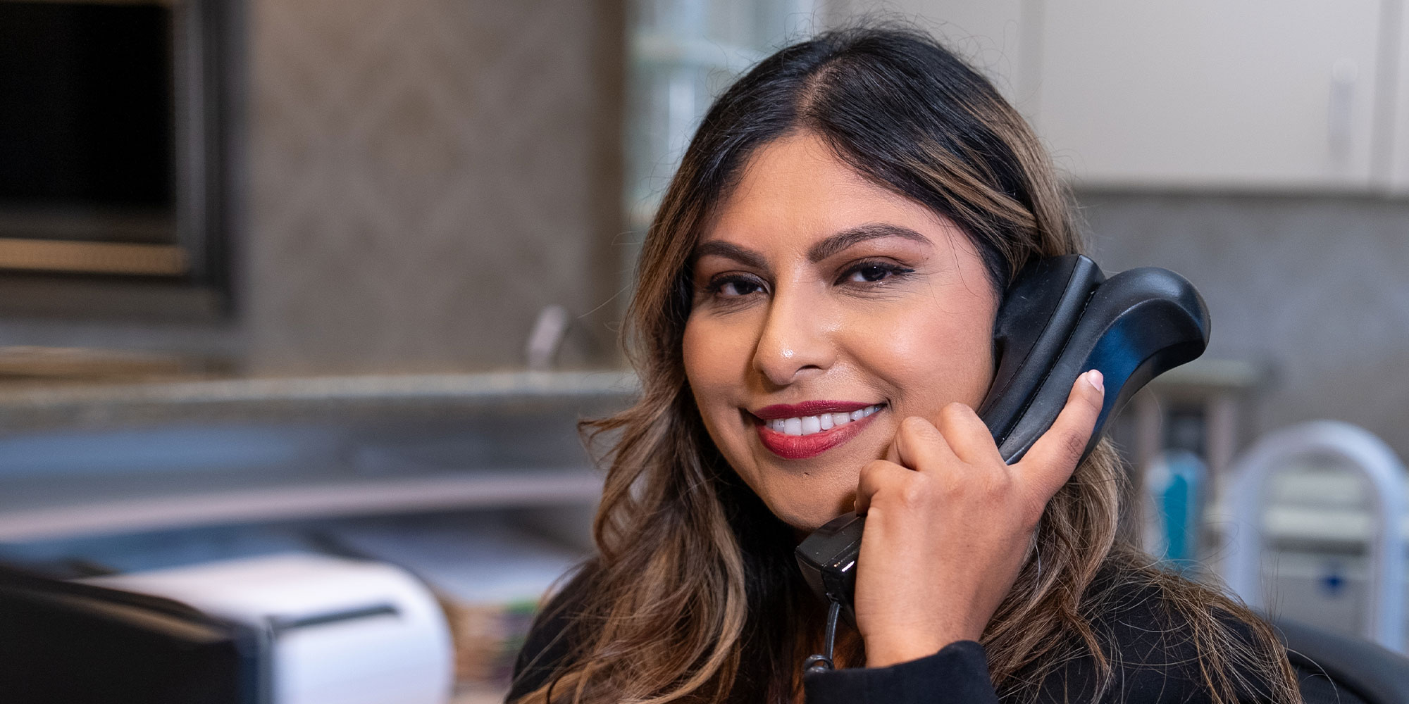 team member on the phone