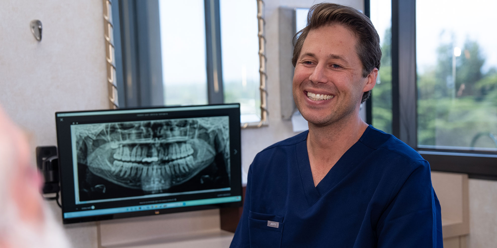 Dentist consulting with Paitent