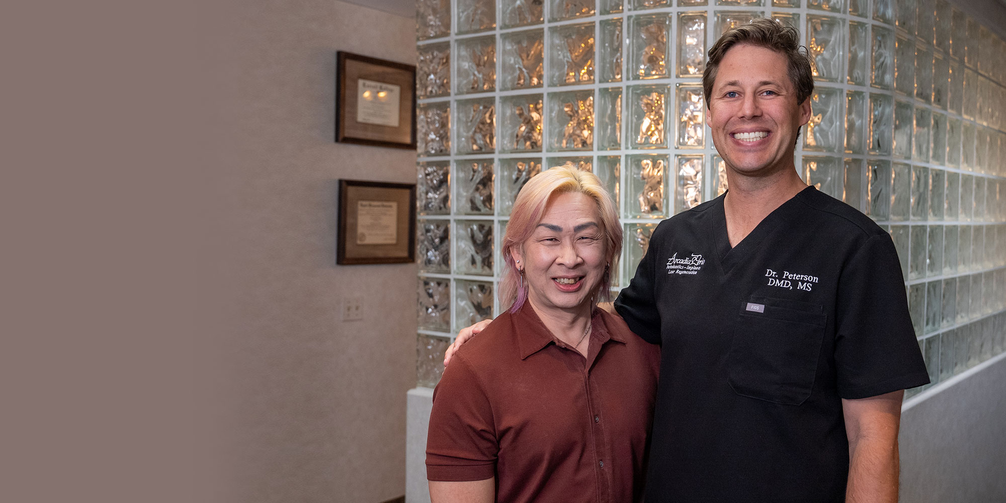 Dentist smiling with Patient