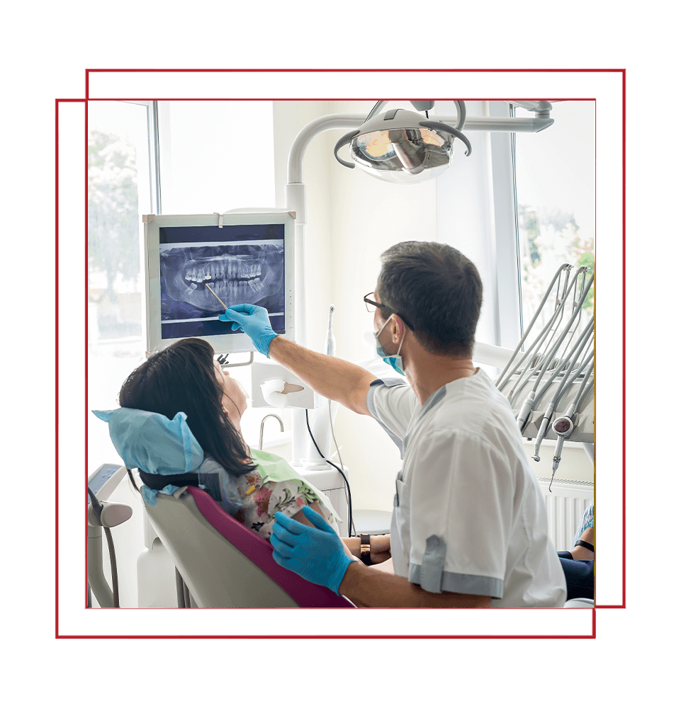 doctor going over dental procedure information with patient